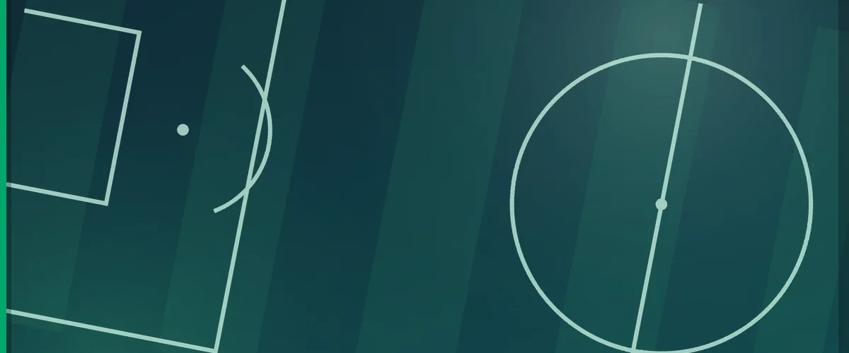 Football pitch markings seen from above, showing the penalty area and the centre circle